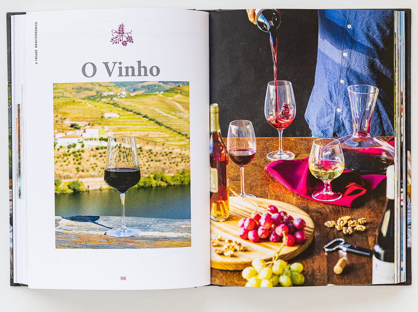 An open book shows “O Vinho” with vineyard and wine images. On the right, ObjectoAnonimo’s Bread, Olive Oil & Wine set creates an inviting Mediterranean spread with red wine, glasses, grapes, cheese, nuts, and fresh bread.
