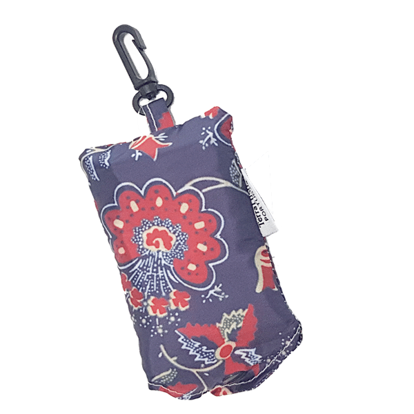 The “Chita” From Alcobaça Eco Shopper by Terra Lusa is a small, rectangular fabric pouch with a red and blue floral design, black plastic clip, and white side tag—perfect as a reusable shopping bag for daily use.