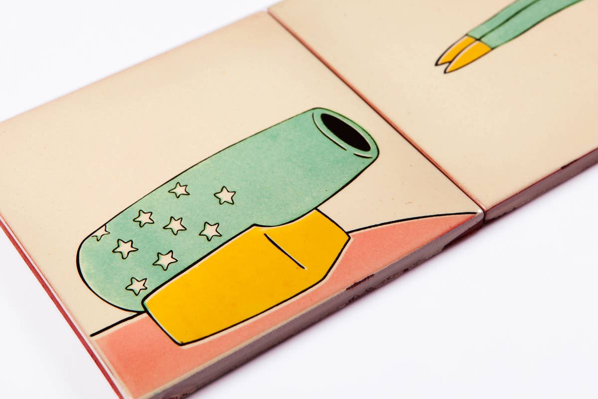 A close-up of two Bussoga Self Adhesive Wall Mural 3 Tiles, Bullet Man tiles: one with a green pencil sharpener and yellow eraser with white stars, the other partially showing a green pencil with a yellow tip.