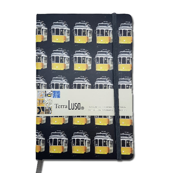 The Tram Notebook by Terra Lusa features a white cover with a repeating yellow tram pattern, celebrating Portuguese heritage. It includes an elastic closure and a branded band labeled Terra Lusa.