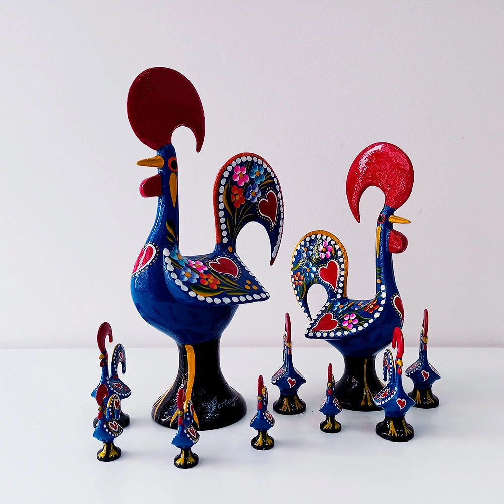 Barcelos Rooster figurines by Iberica - Pretty things from Portugal, inspired by Portuguese art, feature colorful patterns, hearts, and flowers. The ceramic roosters are displayed on a white surface with a plain white background.
