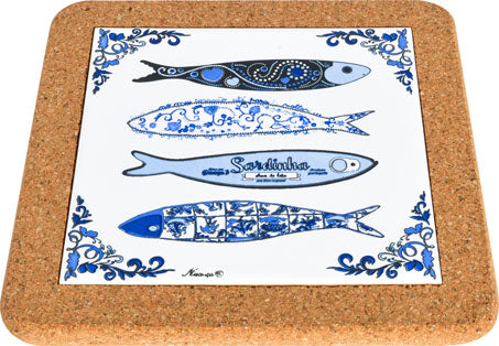 The Trivet Sardines by Barcelos Imports is a square cork-backed trivet featuring four blue and black illustrated sardines with intricate patterns, decorative blue borders, and Sardinha printed on the third fish—a classic Portuguese design.