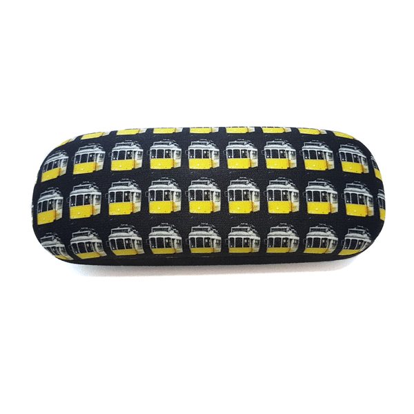 The "Tram" Glasses Case by Terra Lusa features a black frame and a delightful yellow-and-white vintage tram pattern on white, celebrating Portugal's iconic Lisbon trams.