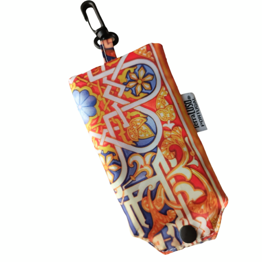 The Stained Glass Eco Shopper by Terra Lusa is a rectangular pouch with a vivid, intricate pattern, black snap button and clip for bags. A small label reads Fapuca Portugal.