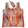The Terra Lusa Stained Glass Eco Shopper features an orange, blue, and yellow geometric pattern and comes with a matching small pouch, both displayed flat.