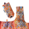 The Stained Glass Eco Shopper by Terra Lusa features vibrant orange, blue, and yellow geometric and floral patterns. One zippered, rectangular bag is shown; other eco-friendly bags are folded or partially visible.