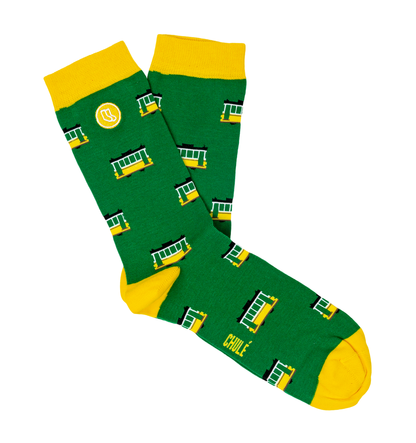 Green socks with yellow toes, heels, and cuffs, decorated with cheerful streetcars and a small logo, are included in the Lisbon Essentials Box by Iberica—Pretty things from Portugal. CHULE is printed near the toe, making them a unique Lisbon-inspired gift.