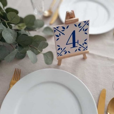 hand painted ceramic tile with a number 4 in blue