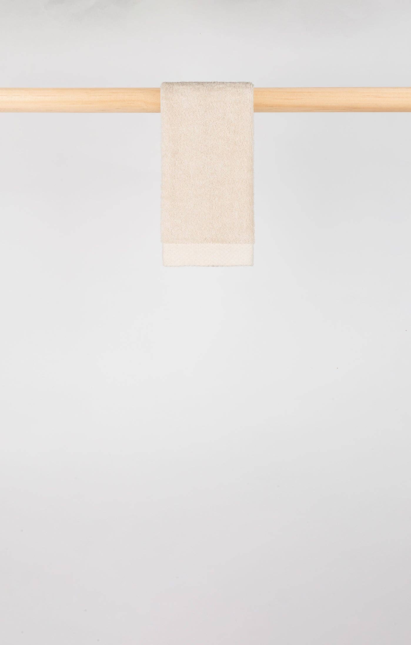 Image of Natural Torres Novas X Zero3 hand towel on a rail