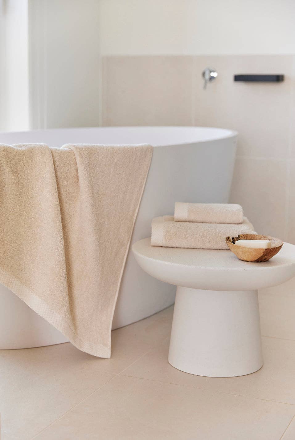 Close-up image of Natural bath towel hanging of a bath tub