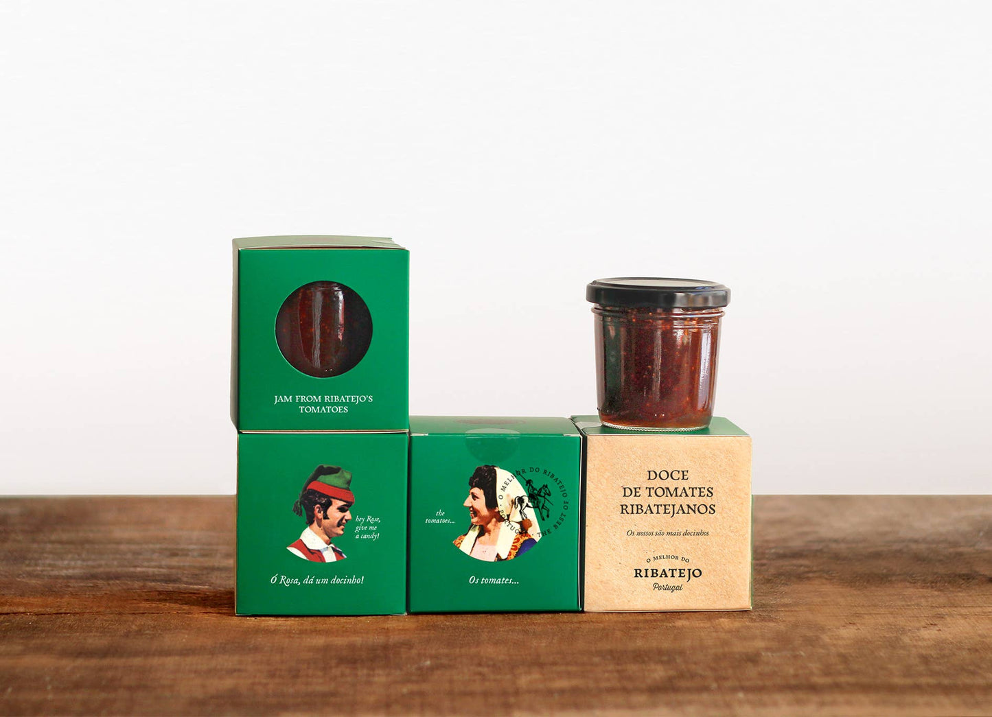 boxes of tomato jam stacked on a wooden table