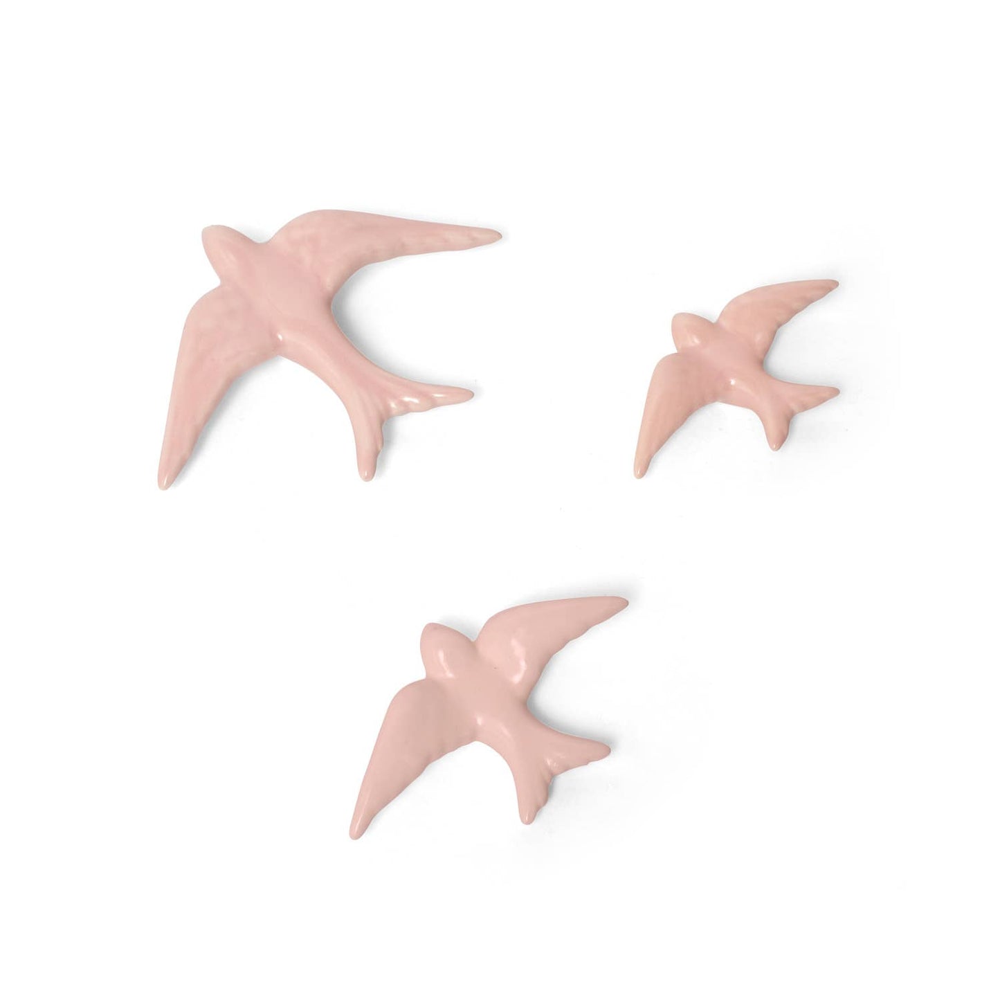 The Casa Atlantica Ceramic Swallows - Set of 3 New Colours features elegant ceramic birds in gliding poses, perfect for adding Mediterranean-inspired charm and a graceful touch to your wall decor.
