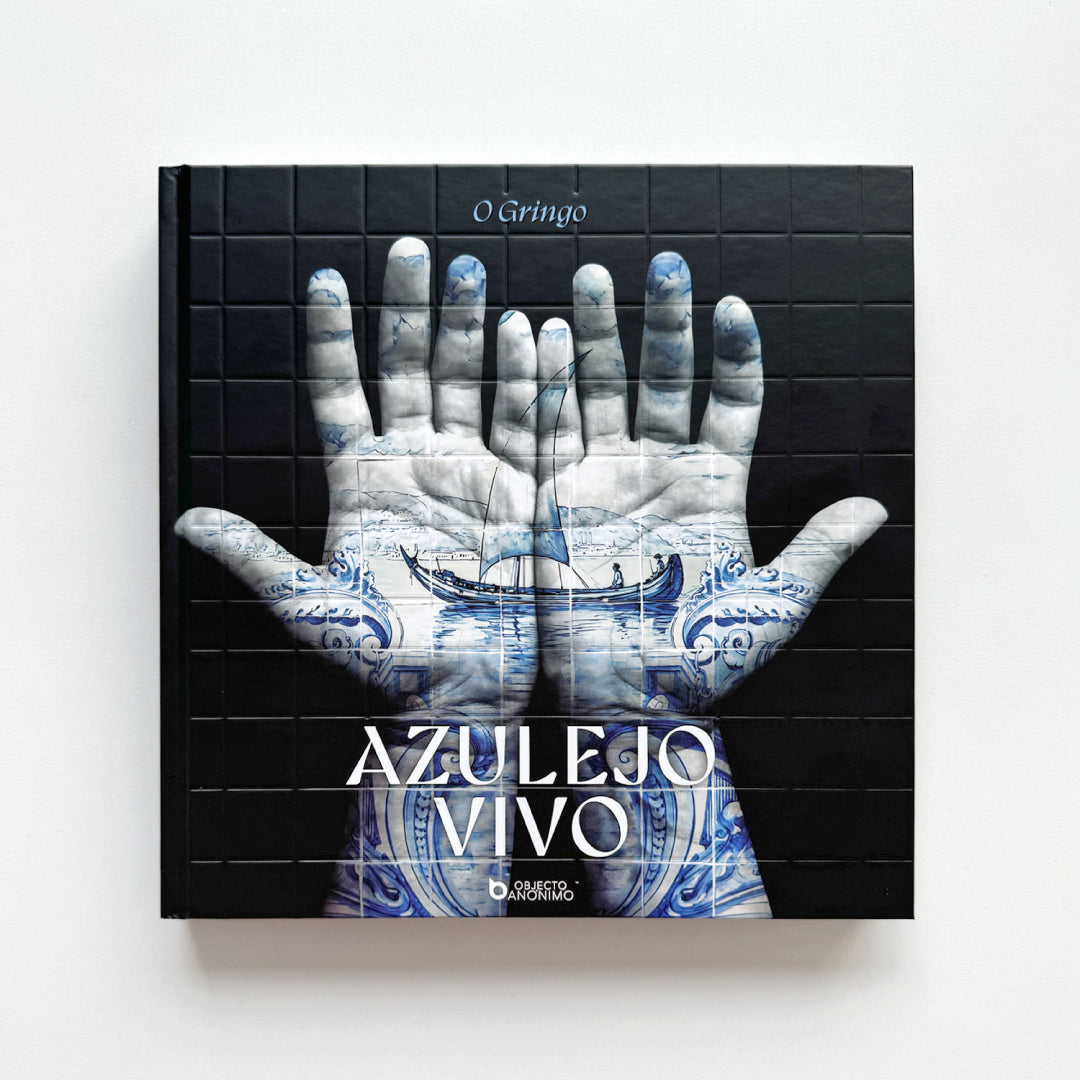 Book cover with a hand design featuring blue and white patterns on a black background