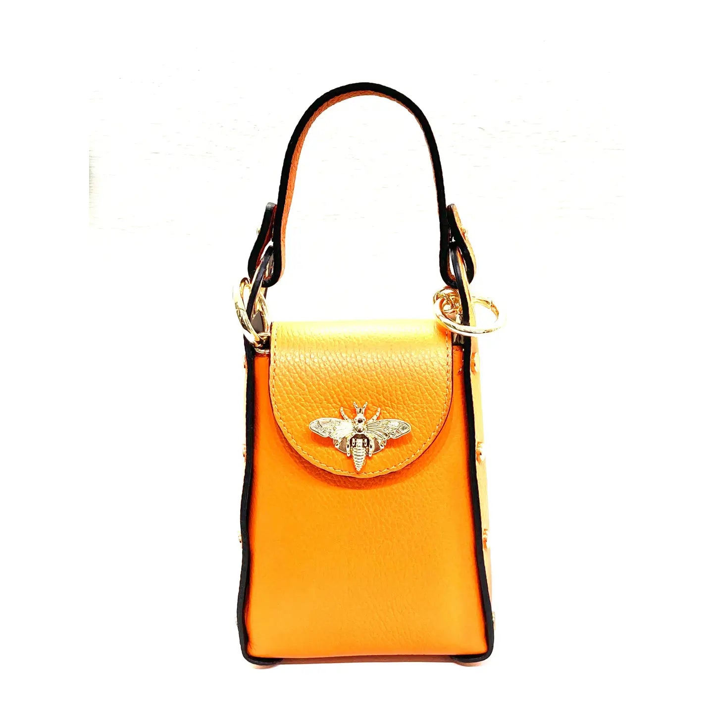The Cassette Barcelona Bee Bag, shown here in vibrant orange leather with gold bee detail, black trim, and gold hardware, is a stylish mini bag with a top handle—ideal as a chic crossbody for any occasion.