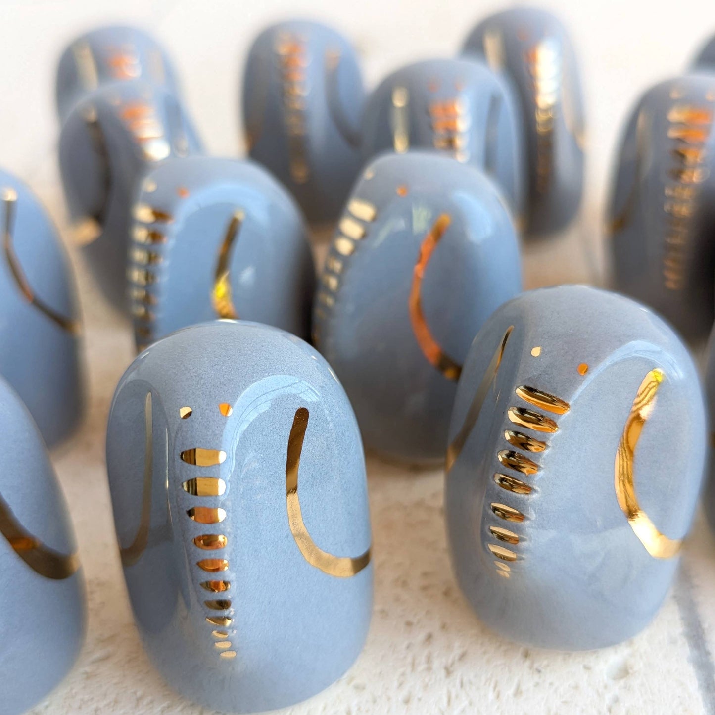 The Amule Elephant of Wisdom "Gold" by Picuru ceramicas features elegant ceramic craftsmanship with gold accents and inscriptions in 5 languages—an ideal, meaningful gift for someone special.