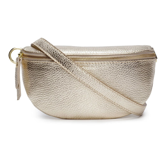 The Cassette Barcelona Leather Fanny Pack Crossbody Bag, featuring premium metallic gold textured leather, a zipper closure, and adjustable strap, is shown against a white background.