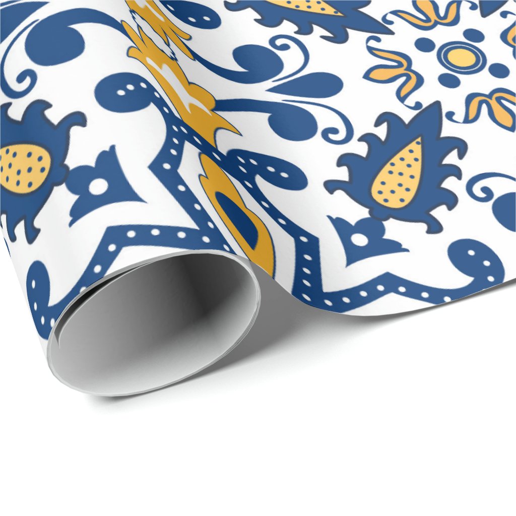 The Fishes serving set by Iberica - Pretty things from Portugal features a bold blue, yellow, and white floral and geometric design inspired by Portuguese coastal ceramics. Seen partially unrolled on a white surface.