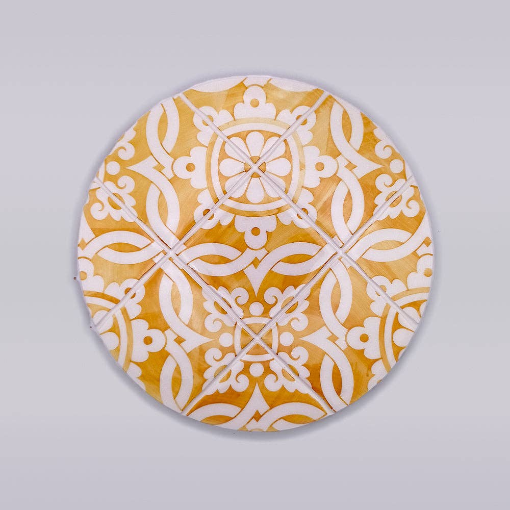 ceramic trivet with yellow motif