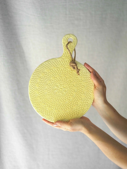 Light yellow crochet  serving ceramic board 