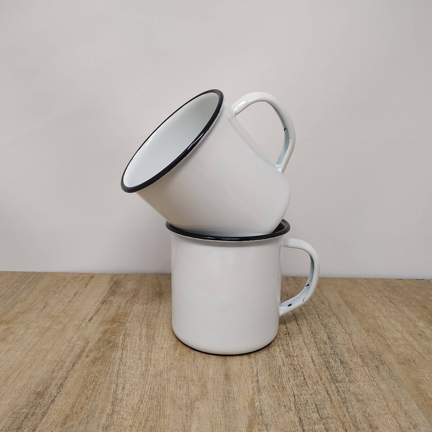 enamel mug stacked on top of another mug