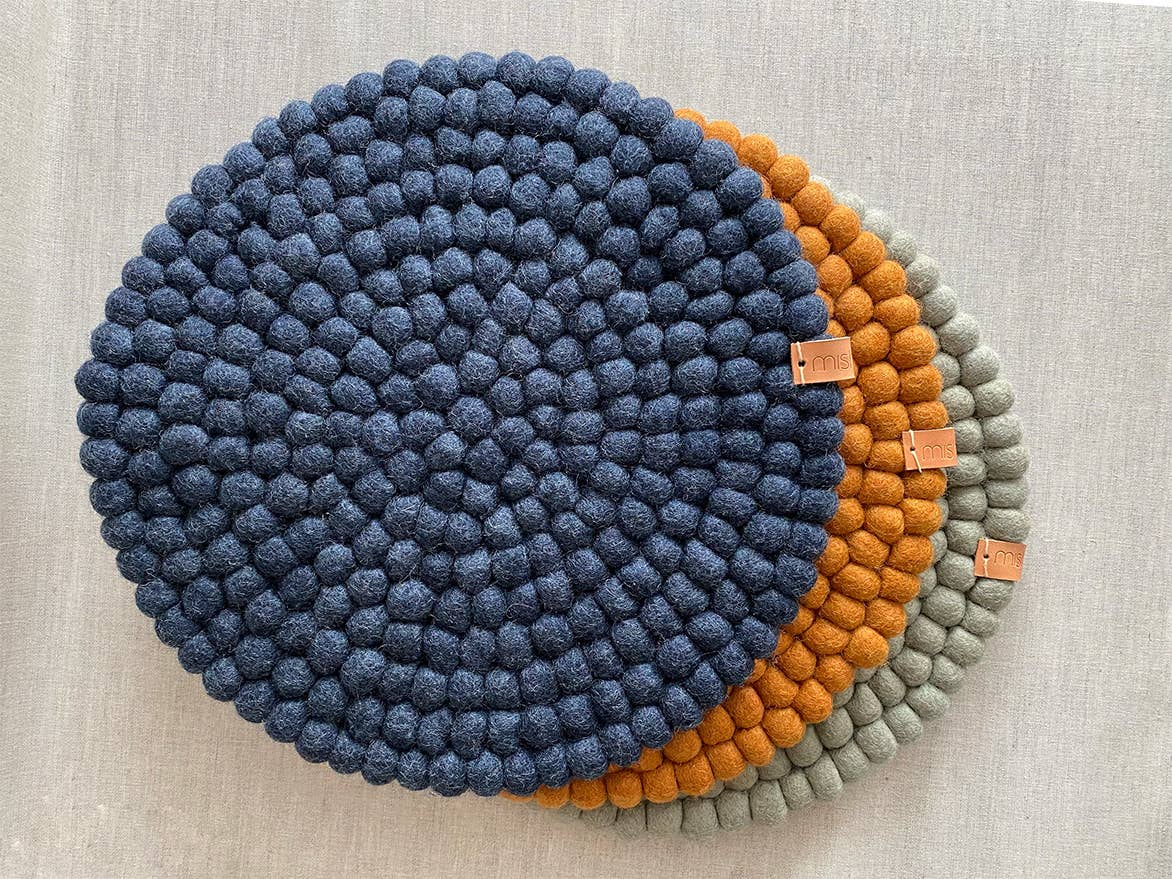 Pipa felt seat pads and table decor in navy, honey and neutral
