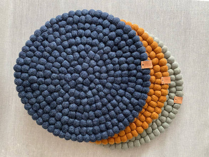 Pipa felt seat pads and table decor in navy, honey and neutral