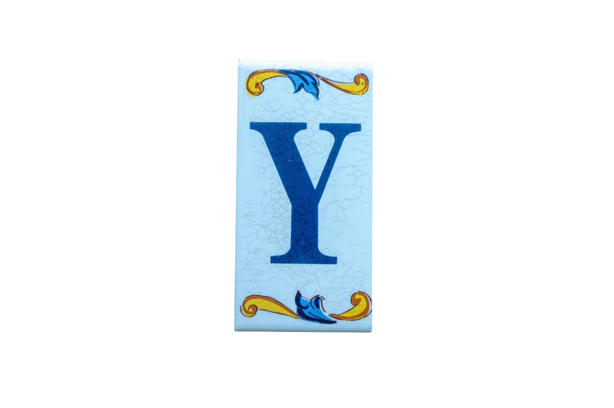 Lisa Croquets Letters – Ceramic House Letter Tile featuring a blue letter Y with decorative yellow and blue scrolls at the top and bottom.
