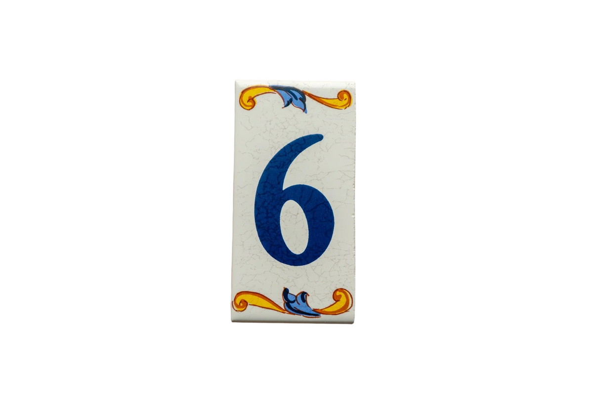 Lisa Croquets Numbers – Ceramic House Number Tile in a rectangular shape featuring the number six in blue, decorated with yellow and blue scrollwork borders.