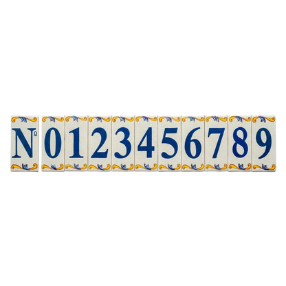 Lisa Croquets Numbers – Ceramic House Number Tiles from LVR Ceramics featuring the number symbol and digits zero through nine in blue, each decorated with blue and yellow scrollwork borders and handcrafted in Spain.