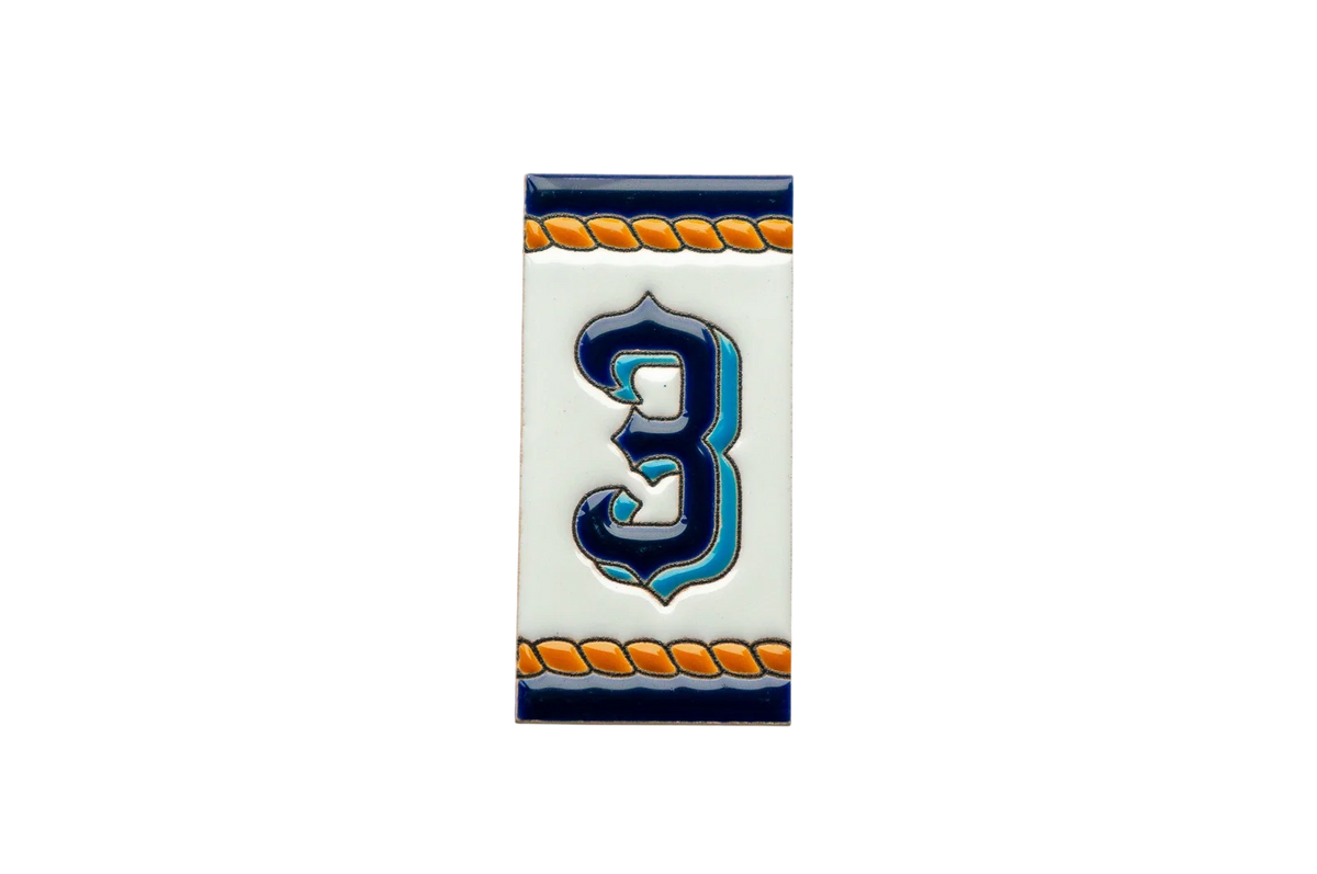 The Marine Ceramic House Number & Letter Tile by LVR Ceramics features a blue number 3 on white, outlined in black with orange rope borders for a nautical Mediterranean touch.