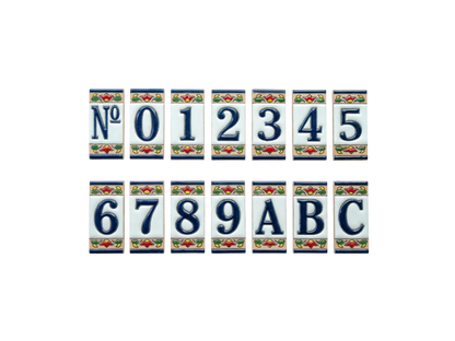Mini Chilli Ceramic House Number & Letter Tile: rectangular handcrafted Spanish tiles featuring blue numbers 0–9, letters A–C, and a No symbol, each decorated with a red and green chili motif.