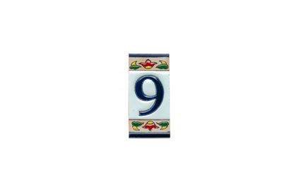 Mini Chilli Ceramic House Number & Letter Tile: a handcrafted Spanish rectangular ceramic tile featuring the number nine in navy blue, bordered by a floral pattern in red, green, and tan.