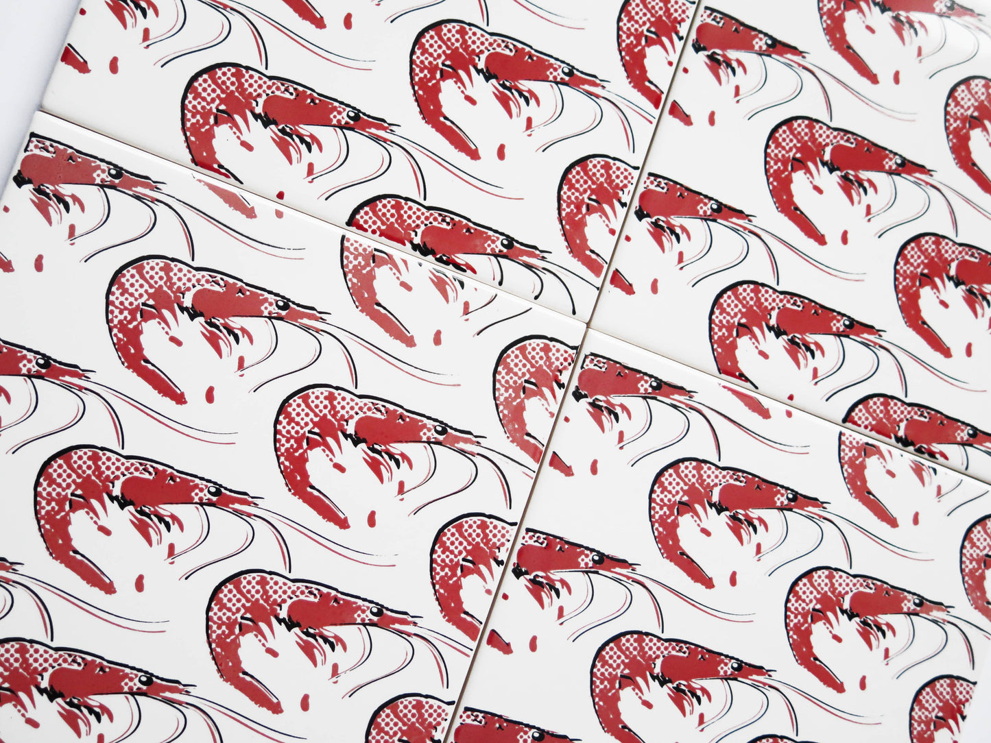 Spanish ceramic adhesive wall tiles featuring illustrated prawns motif