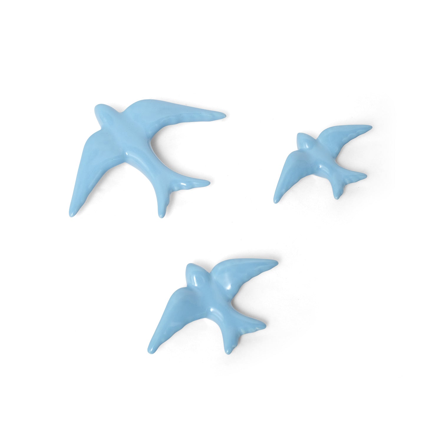 Casa Atlantica’s Ceramic Swallows Individual Items (Auritas) in new colors are arranged against a white backdrop, evoking Mediterranean charm and creating stylish wall decor reminiscent of birds flying together.