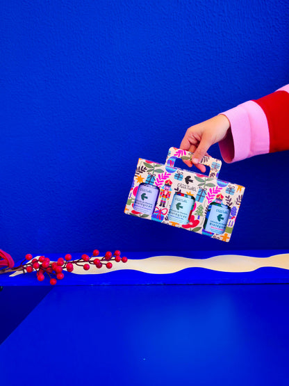Close-up of festive Christmas illustrations by Portuguese artist Teresa Rego on CRIATURA tea packaging