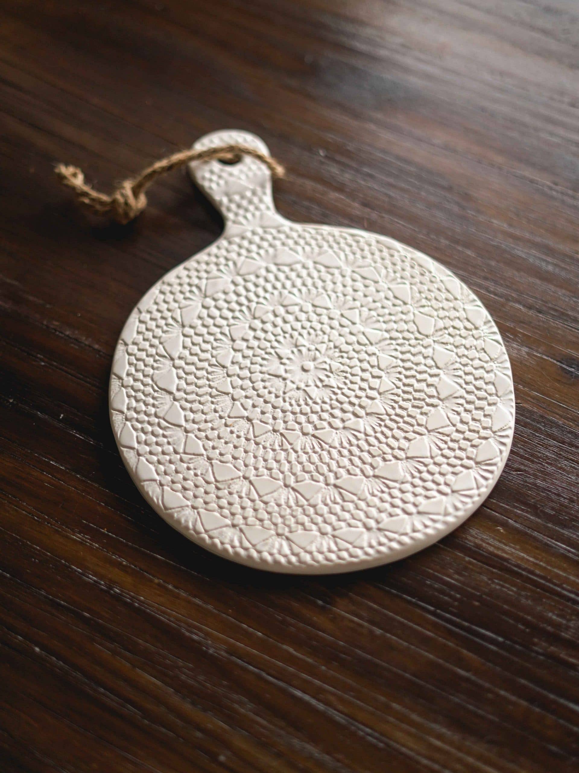 Round beige ceramic crochet board