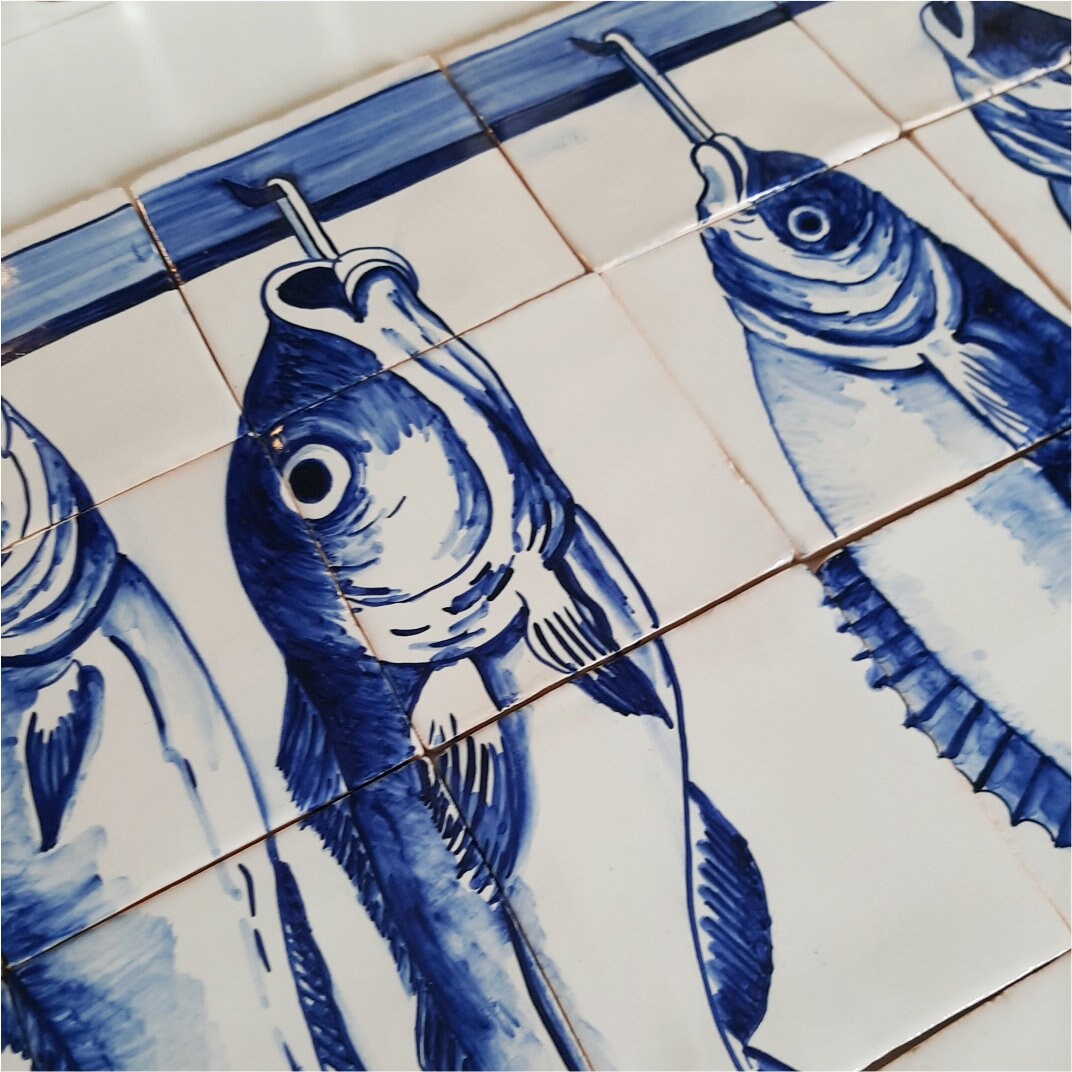 Hand painted Portuguese tile with fish on a hook