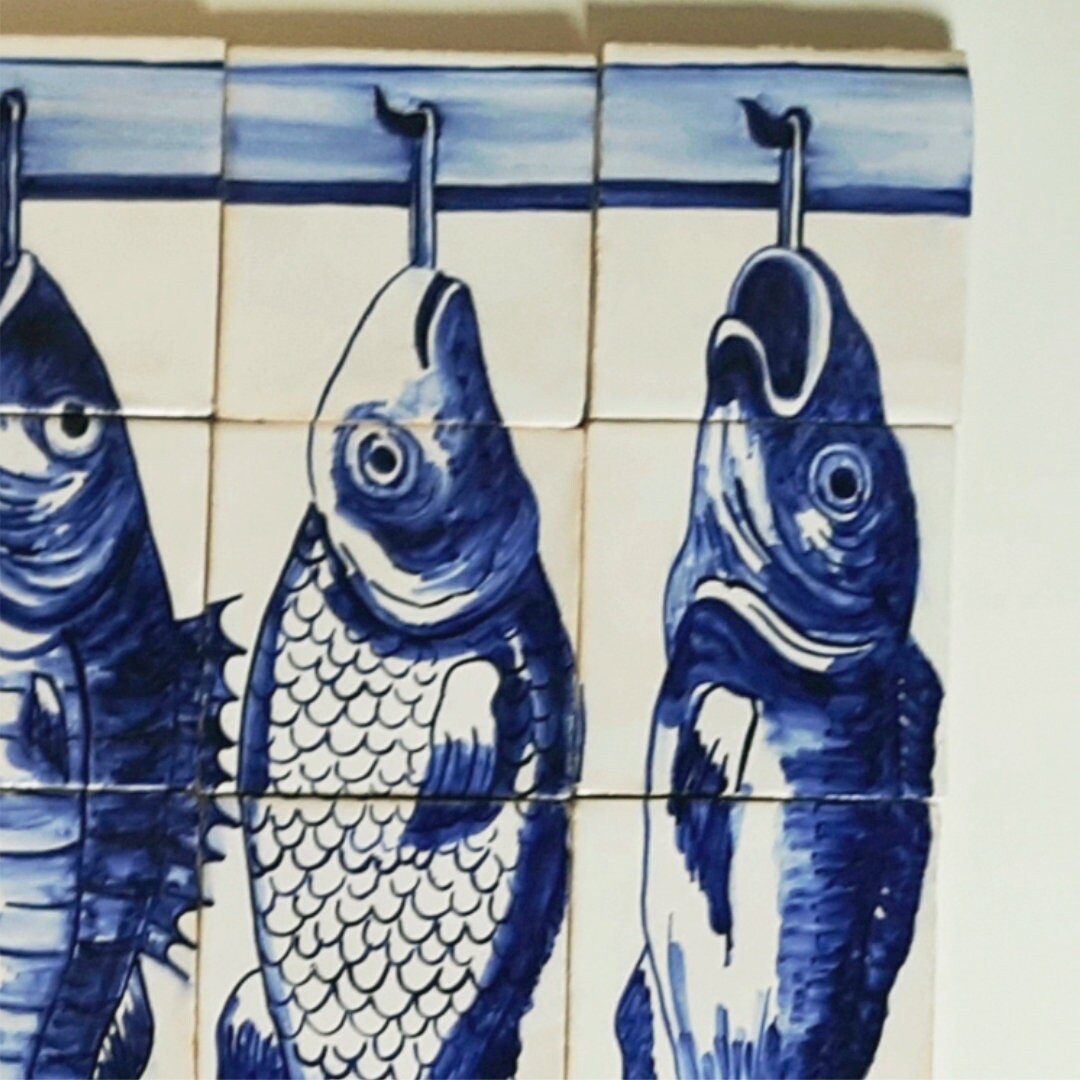 Portuguese tile with a fish hanging from a hook